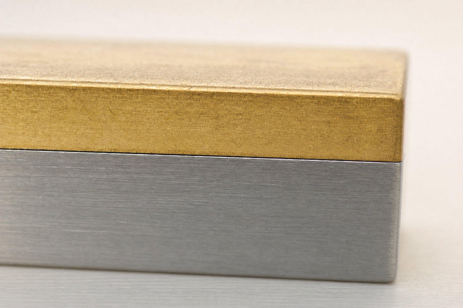 Gold bonded to a brushed steel edge, shown in macro