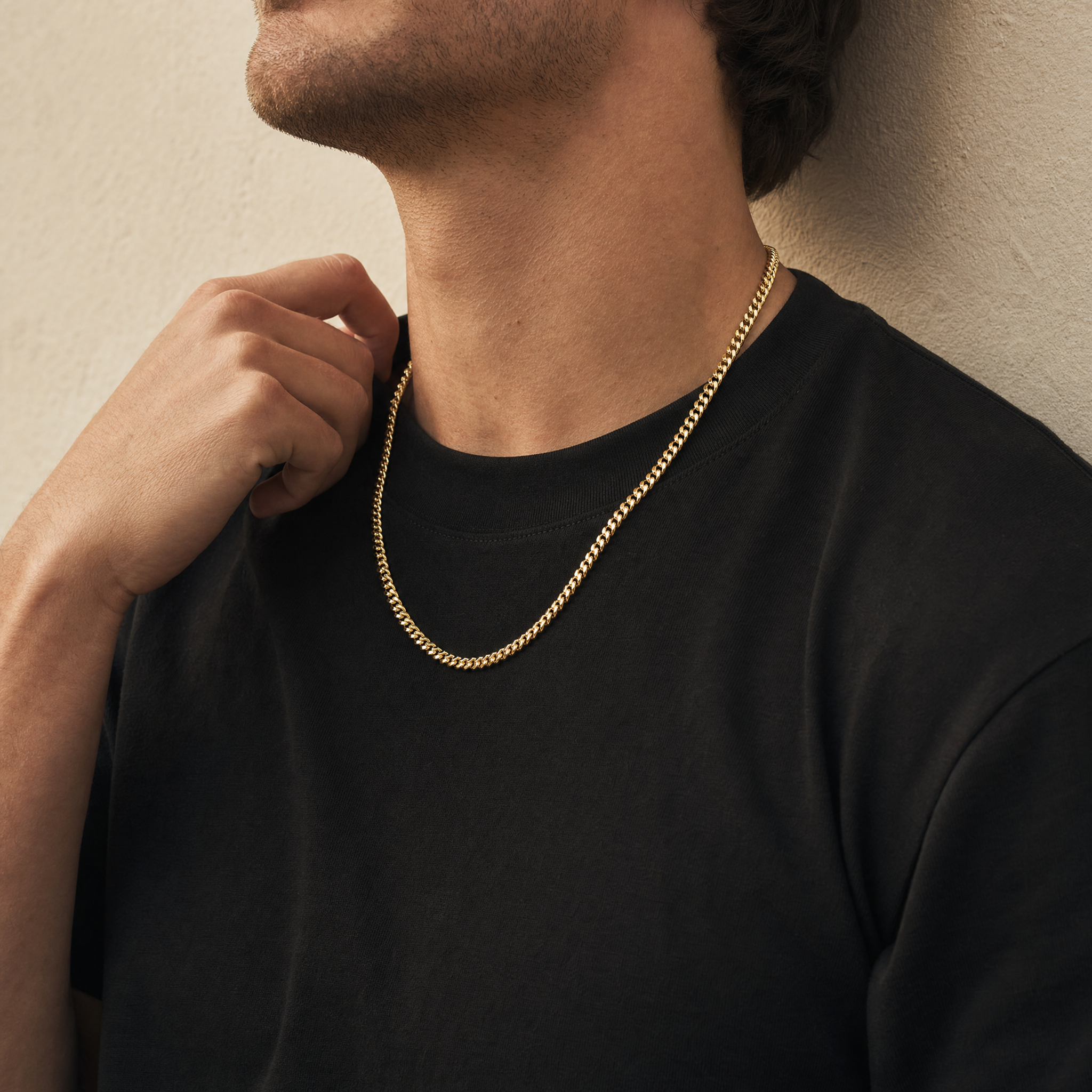 Man wearing the 5mm gold Cuban chain in warm daylight