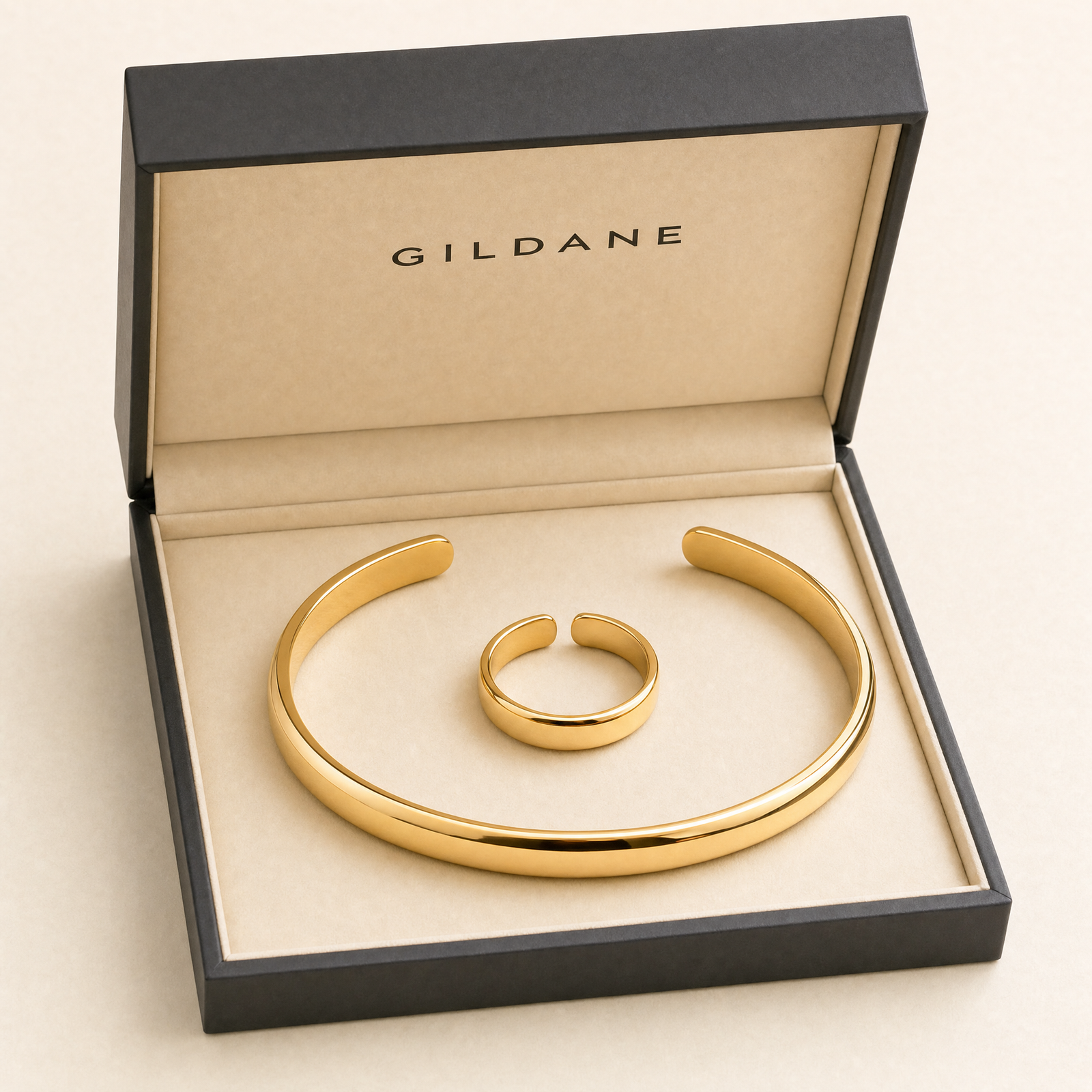 Gold cuff and ring set in the GILDANE gift box