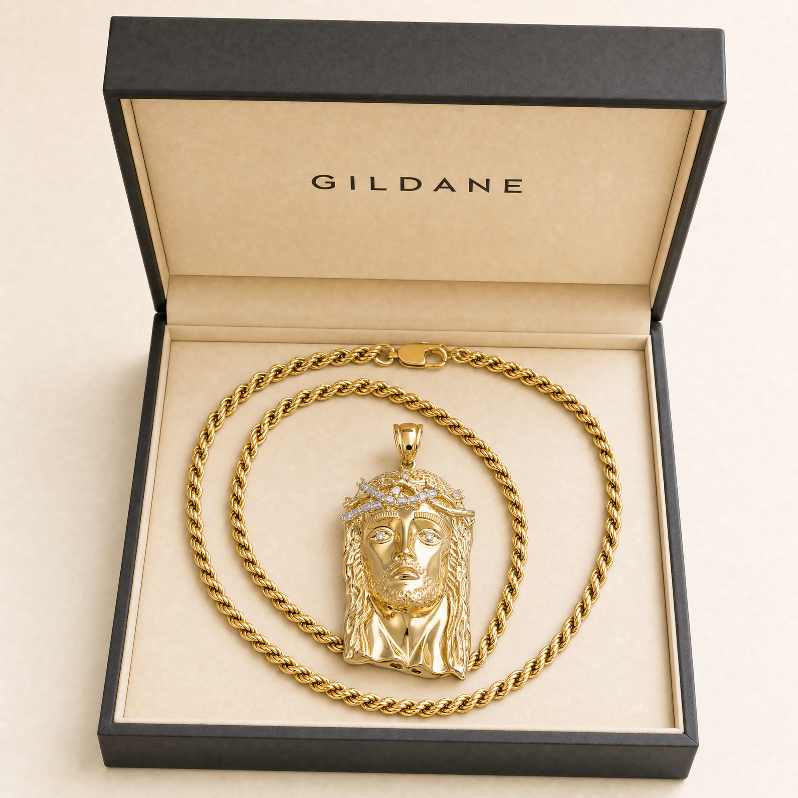 Gold Jesus pendant and rope chain in the GILDANE gift box