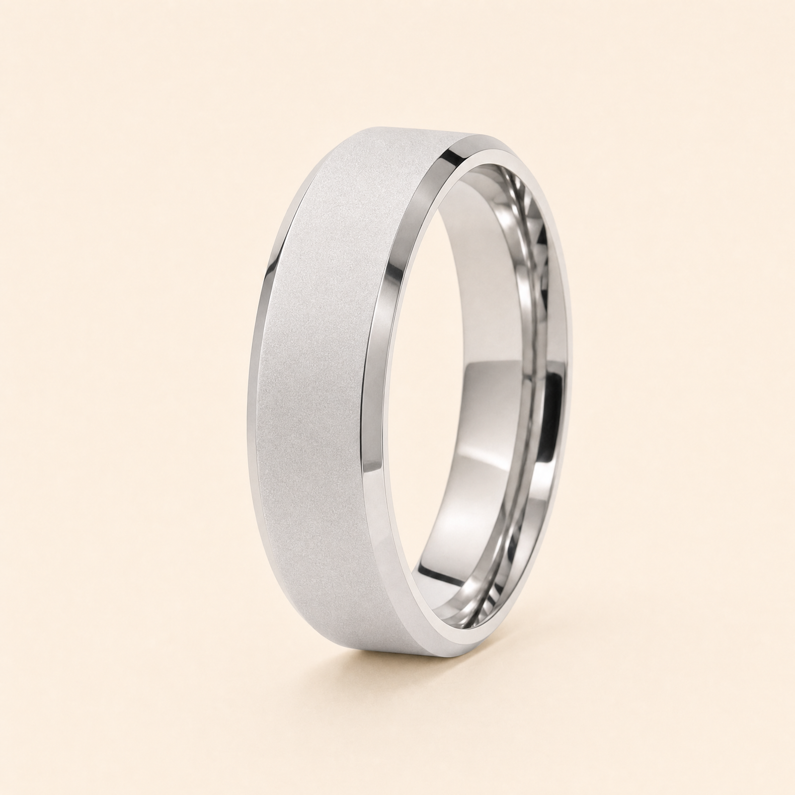Silver · Ice matte — men's 5mm beveled wedding band with frosted ice matte finish standing on seamless ivory